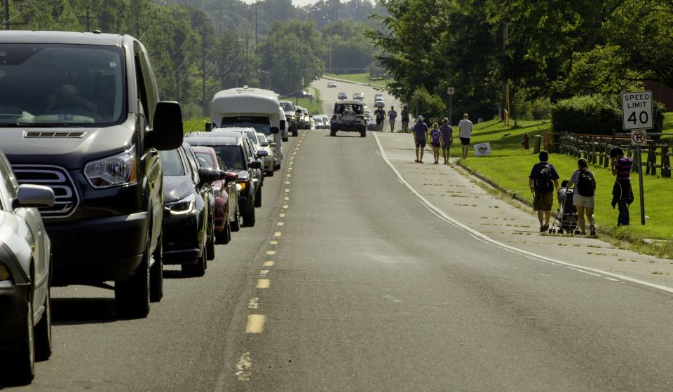 Traffic slows down on Pleasant Hill Road in Carbondale as people arrive to view the total solar eclipse Monday, Aug. 21, 2017. [Ted Schurter/The State Journal-Register]