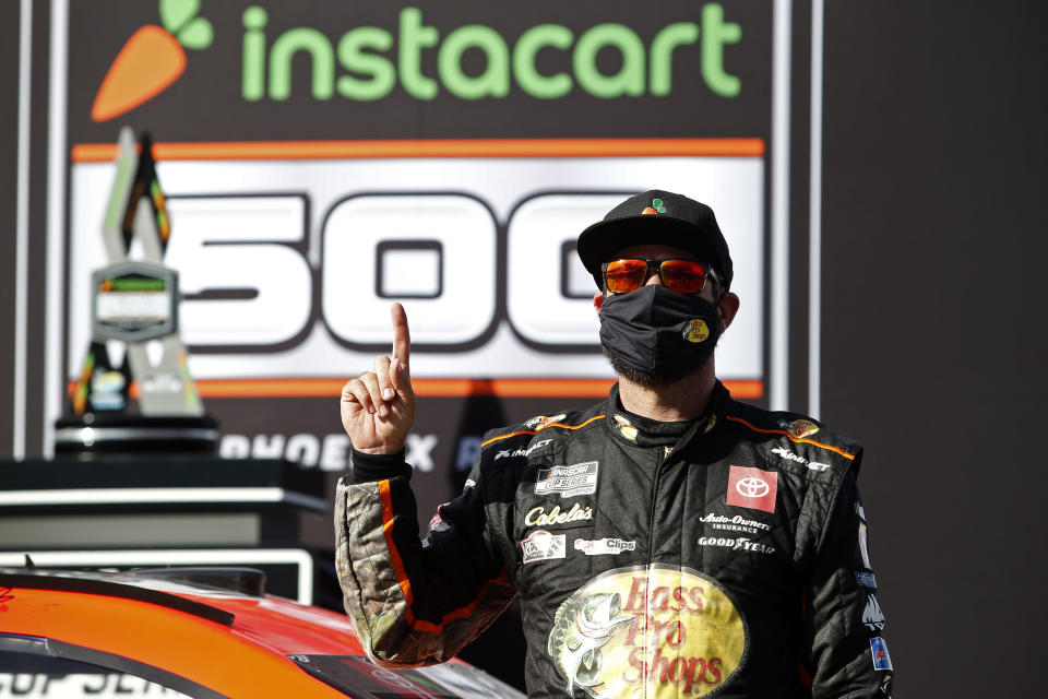 Martin Truex Jr. celebrates in Victory Lane after winning a NASCAR Cup Series auto race at Phoenix Raceway, Sunday, March 14, 2021, in Avondale, Ariz. (AP Photo/Ralph Freso)