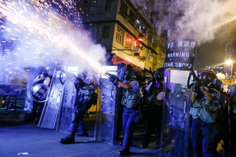 FILE PHOTO: Police fire tear gas at anti-extradition bill protesters during clashes in Sham Shui Po in Hong Kong