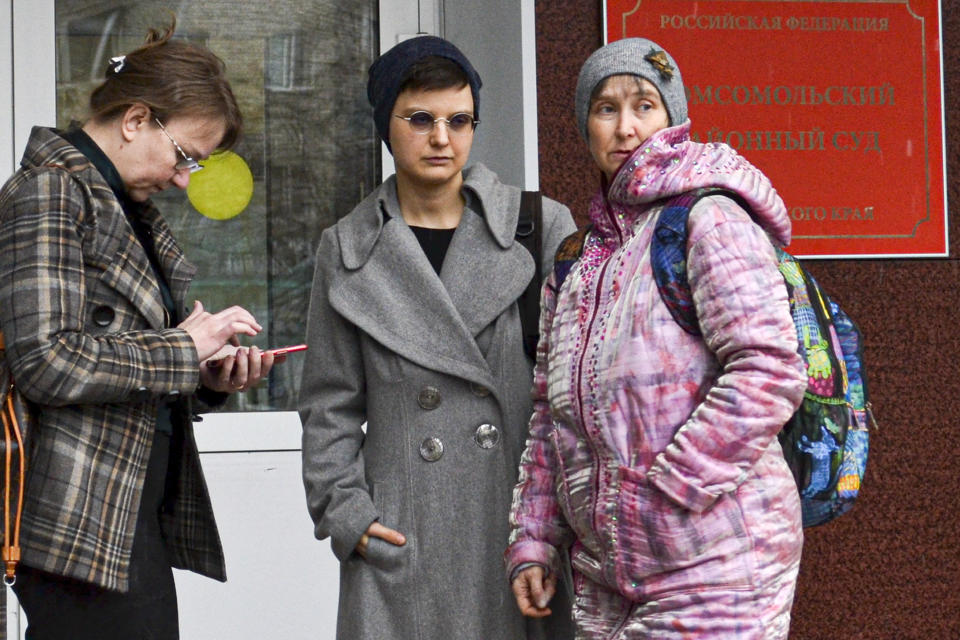 Feminist activist and artist Yulia Tsvetkova, center, her mother Anna Khodyreva, right, and her lawyer Irina Ruchko leave a court session in Komsomolsk-on-Amur, Russia, Monday, April 12, 2021. Tsvetkova, 27, stands trial on charges of disseminating pornography after she shared artwork depicting female anatomy online. The controversial case, in line with the Kremlin's conservative stance promoting "traditional family values," has elicited outrage at home and abroad, with human rights organizations urging the authorities to drop all charges against Tsvetkova. (AP Photo/Alexander Permyakov)