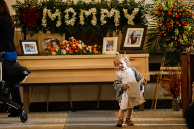 A relative of Christina Marie Langford Johnson, who was killed by unknown assailants, is pictured during her funeral service before a burial at the cemetery in LeBaron, Chihuahua