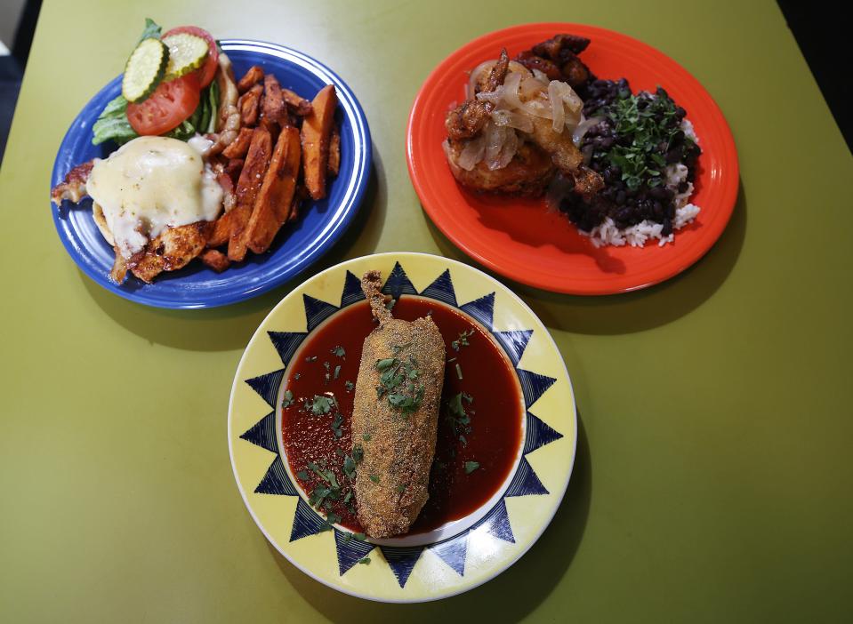 The cajun chicken melt (left), chile relleno and Cuban chicken are among the choices on the Starliner Diner menu.