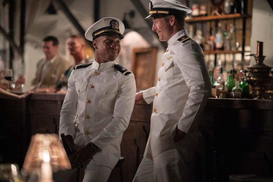 Jesse Brown (Jonathan Majors, left) and Tom Hudner (Glen Powell) are ace Navy aviators and friends in the Korean War drama "Devotion."