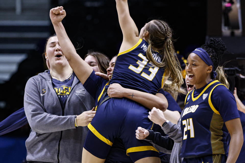 Toledo guard Yaniah Curry (24), guard Sammi Mikonowicz (33), and guard Justina King (1) celebrate after a first-round college basketball game against Iowa State in the NCAA Tournament, Saturday, March 18, 2023, in Knoxville, Tenn. (AP Photo/Wade Payne)