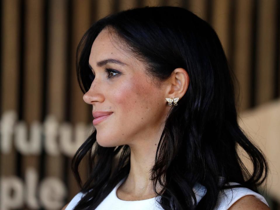 Meghan Markle wearing butterfly earrings that belonged to Princess Diana