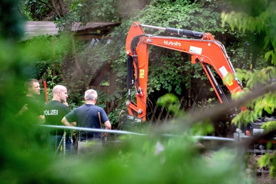 German police work with a digger during a search in a garden allotment in the northern German city of Hanover (AFP via Getty Images)