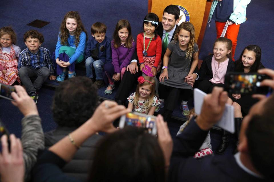 Paul Ryan poses with children for a photo