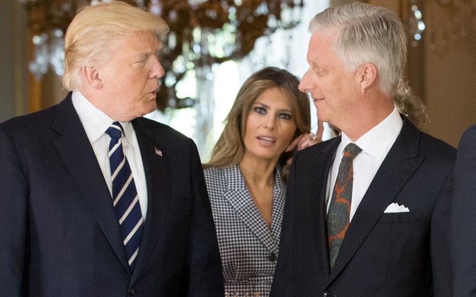 US President Donald Trump (L), King Philippe - Filip of Belgium (R) and First Lady of the US Melania Trump - Credit: BENOIT DOPPAGNE/AFP