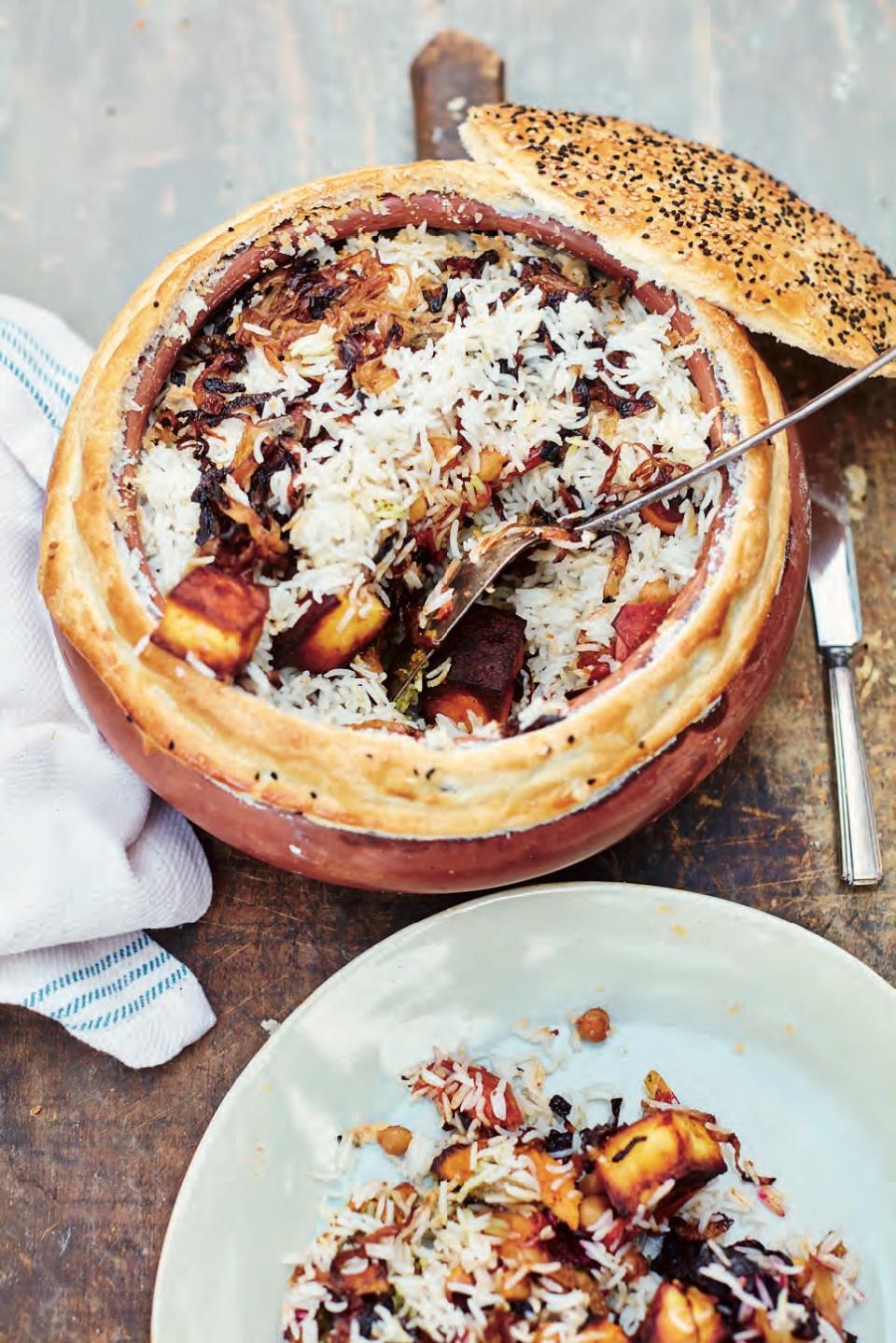 This stunning biryani stuffed with sweet potatoes, beets, chickpeas, paneer, and spices—and topped with a cap of crackling, golden puff pastry—makes a fabulous vegetarian celebration feast. <a href="https://www.epicurious.com/recipes/food/views/mast-biryani-grand-vegetable-biryani-meera-sodha?mbid=synd_yahoo_rss" rel="nofollow noopener" target="_blank" data-ylk="slk:See recipe.;elm:context_link;itc:0" class="link ">See recipe.</a>