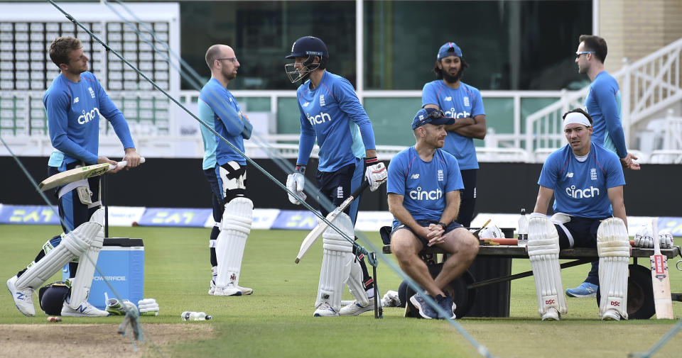 England's Jos Buttler, left, Jack Leach, 2nd left, captain Joe Root, 3rd left, and Rory Burns, far right, during nets practice prior to the first Test Match between England and India at Trent Bridge cricket ground in Nottingham, England, Tuesday, Aug. 3, 2021. (AP Photo/Rui Vieira)