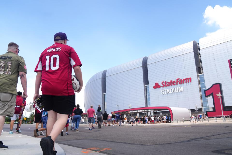 Fans head to the the Arizona Cardinals Back Together Saturday Practice at State Farm Stadium in Glendale, Ariz. on Saturday, July 30, 2022. 