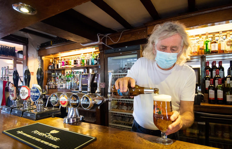 Phil Weaver, owner of The Old Smith in Church Lawford, Warwickshire pours a drink as pub and hospitality bosses have cheered the Government's proposals to allow customers through their doors again on July 4 as "a welcome relief".