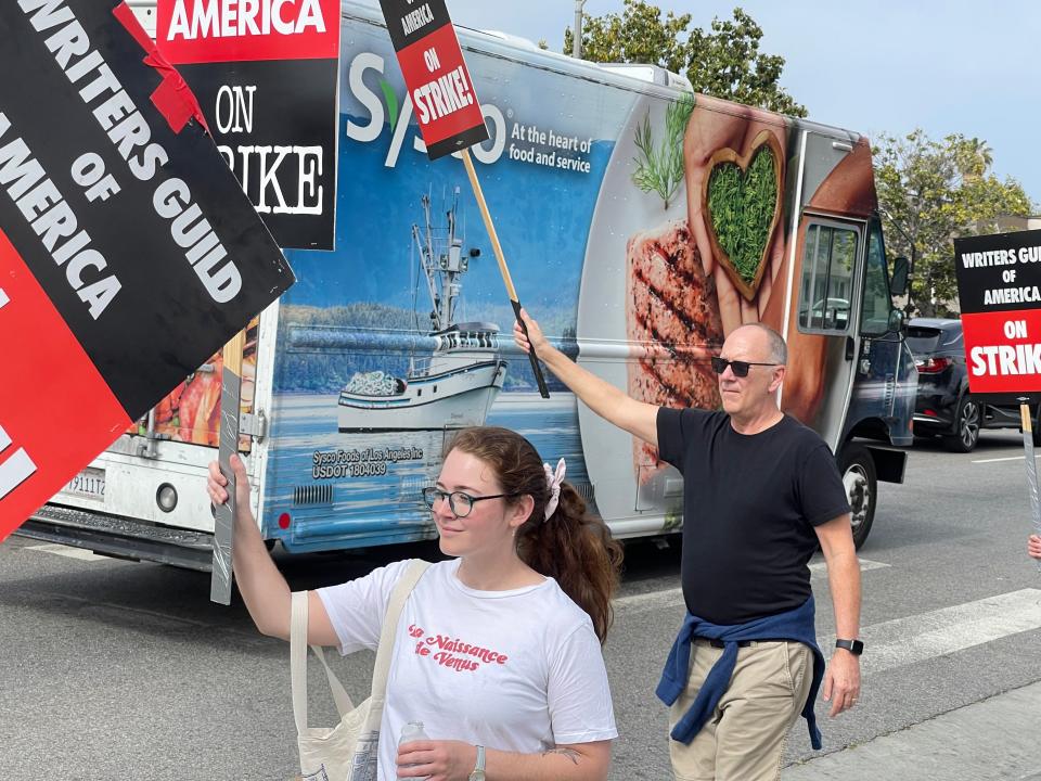 Palm Springs resident David A. Lee participates in a WGA picket in front of CBS Television City in Los Angeles on May 19.