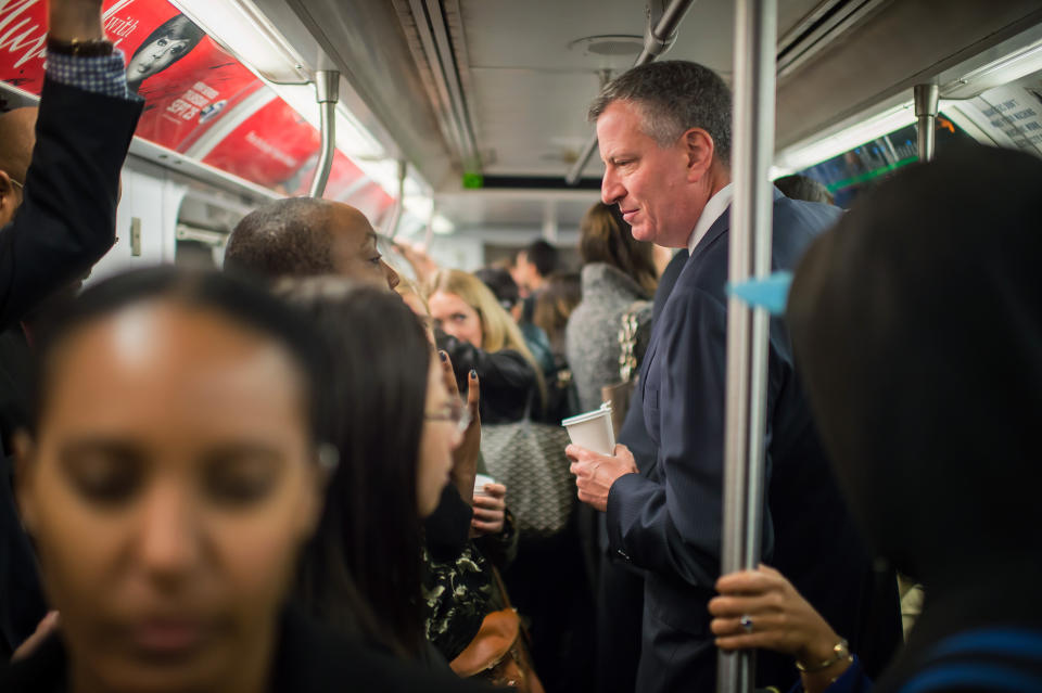 Mayor Bill de Blasio takes the subway on his route to City Hall, on October 24, 2014 in New York City.