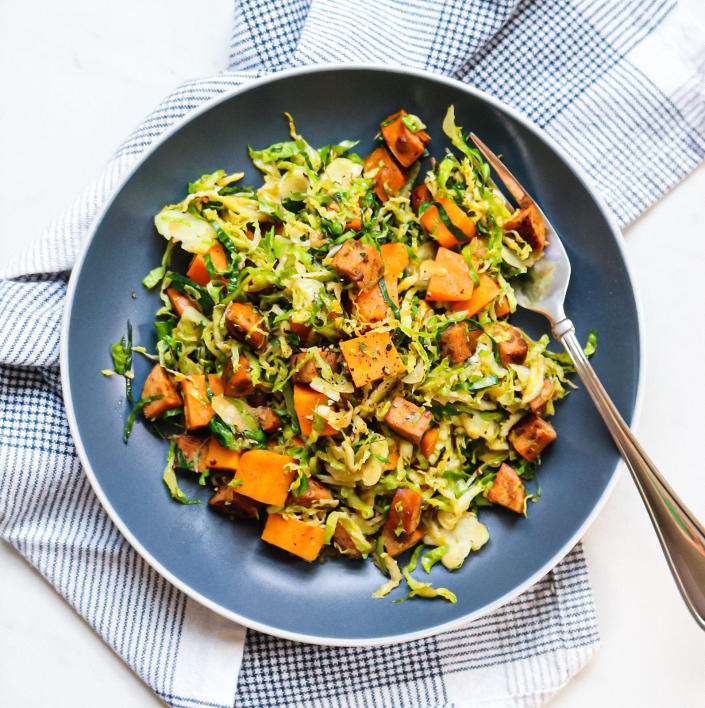 <p>Apple-flavored chicken sausage adds flavor and protein in this quick dinner hash that uses a bag of shaved Brussels sprouts as its hearty, high-fiber base. Steaming the cubed sweet potatoes in the microwave cuts way down on total cook time. <a href="https://www.eatingwell.com/recipe/7889838/3-ingredient-sweet-potato-brussels-sprout-hash-with-apple-chicken-sausage/" rel="nofollow noopener" target="_blank" data-ylk="slk:View Recipe" class="link ">View Recipe</a></p>