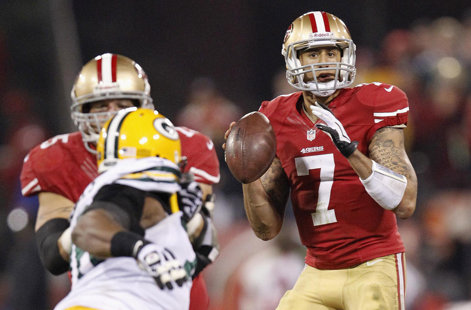 FILE - San Francisco 49ers quarterback Colin Kaepernick (7) looks for a receiver during the second quarter of the team's NFC divisional playoff NFL football game against the Green Bay Packers in San Francisco, Jan. 12, 2013. Kaepernick had replaced Alex Smith as starter late that season and established himself as a phenomenon when he ran for a quarterback-record 181 yards and two scores and threw for 263 yards and two TDs in a 45-31 San Francisco win. (AP Photo/Tony Avelar, File)