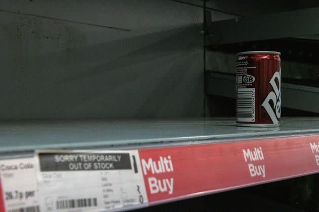 One remaining can of soft drink on a near-empty shelf at Asda (Photo: Chris J Ratcliffe via Getty Images)