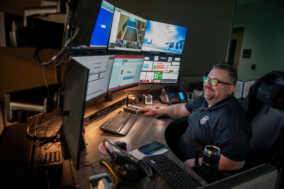 Mike Torosian, an Ashland public safety telecommunicator, works inside the combined dispatch center, April 3, 2023.