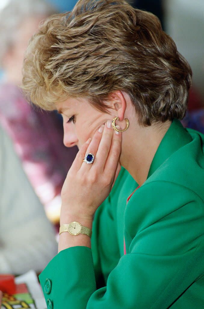 <p>While the <a href="https://www.townandcountrymag.com/style/jewelry-and-watches/g36157351/princess-diana-kate-middleton-sapphire-jewelry-photos/" rel="nofollow noopener" target="_blank" data-ylk="slk:sapphire engagement ring;elm:context_link;itc:0;sec:content-canvas" class="link ">sapphire engagement ring</a> is eye-catching, Princess Diana's gold watch and hoops are also fashionable selections.</p>