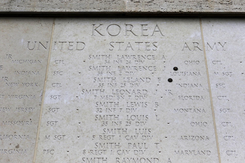 The Honolulu Memorial Korean War Courts of the Missing memorial wall is shown at the National Memorial Cemetery of the Pacific in Honolulu on Monday, July 30, 2018. The names of all U.S. soldiers who did not return from the Korean War are listed on the memorial. Human remains handed over to the U.S. government from North Korea are expected to arrive Wednesday in Honolulu, where scientists will begin the painstaking process of trying to match DNA from the bones to those of American soldiers who didn't return from the Korean War more than a half century ago. (AP Photo/Caleb Jones)