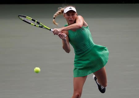 Tennis - Pan Pacific Open Women's Singles Final match - Ariake Coliseum, Tokyo, Japan - 25/09/16. Caroline Wozniacki of Denmark returns the ball against Naomi Osaka of Japan. REUTERS/Issei Kato