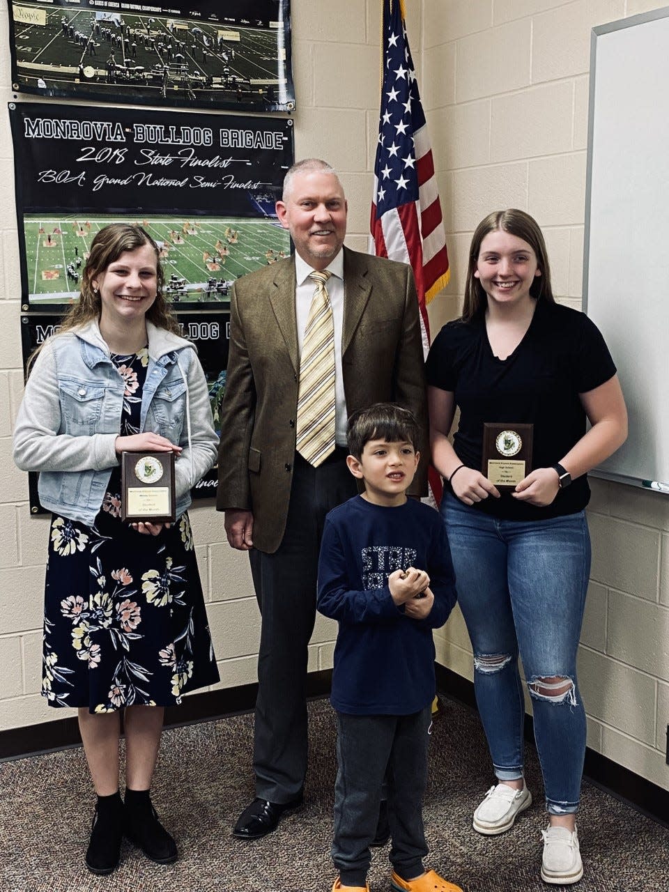 Superintendent Dr. Kirk Freeman, pictured with the students of the month.