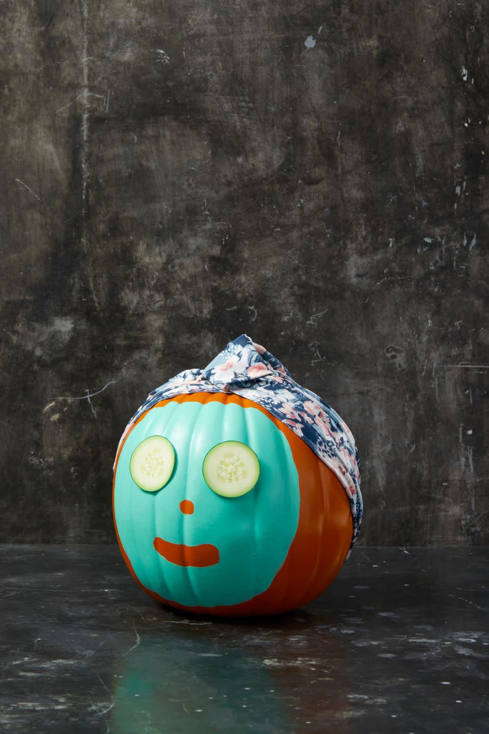 <p>To make this spa-going pumpkin face, simply paint a "face mask" onto a real or faux pumpkin, leaving spaces for the nose and mouth. Let it dry completely. Then, stretch a decorative shower cap onto the pumpkin's "head" and pin it in place with straight pins. To make the cucumber eyes, just print images of cucumbers from a picture online and glue them on. </p><p><strong>RELATED:</strong> <a href="https://www.goodhousekeeping.com/holidays/halloween-ideas/g2592/pumpkin-painting-ideas/" rel="nofollow noopener" target="_blank" data-ylk="slk:30+ Pumpkin Painting Ideas for a Fun Halloween;elm:context_link;itc:0;sec:content-canvas" class="link ">30+ Pumpkin Painting Ideas for a Fun Halloween</a></p>