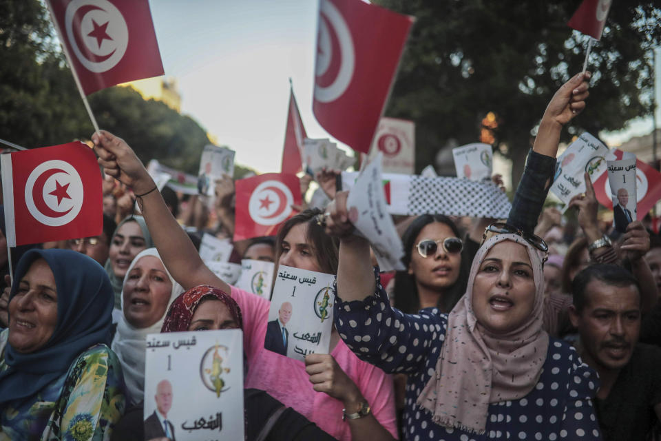 Supporters of independent Tunisian Presidential candidate Kais Saied attend a rally on the last day of campaigning before the second round of the presidential elections, in Tunis, Tunisia, Friday, Oct. 11, 2019. (AP Photo/Mosa'ab Elshamy)