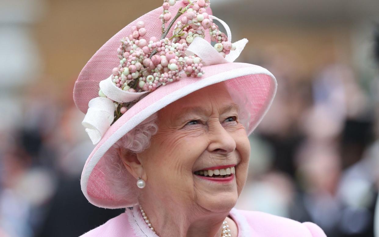 File photo dated 29/05/19 of Queen Elizabeth II meeting guests during a Royal Garden Party at Buckingham Palace in London. The Queen is set to enter the milestone 70th year of her reign, as she prepares to mark the anniversary of her accession away from Sandringham for the first time in more than 30 years. Issue date: Friday February 5, 2021. PA Photo. Elizabeth II - the nation's longest reigning monarch - will reach 69 years on the throne on February 6, meaning she is just one year away from her Platinum Jubilee.  - Yui Mok/PA Wire