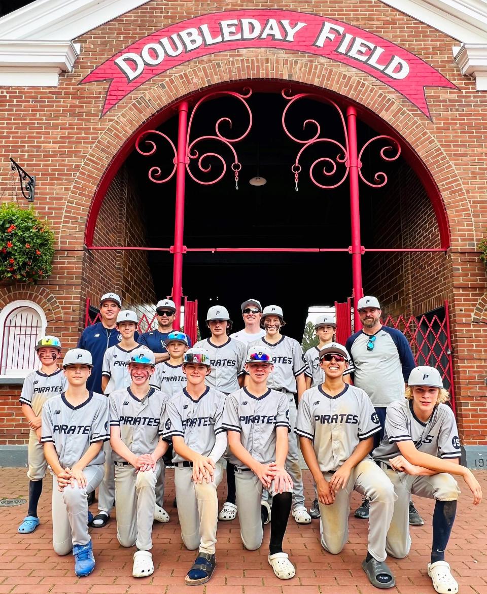 The Seacoast Pirates Dover 14-year-old baseball team stand outside historic Doubleday Field in Cooperstown, New York on Thursday. The Pirates beat a team from Australia, 7-6 in a nine-inning game.