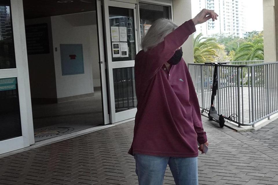 Broward Schools attorney Barbara Myrick hides her face as she is released from the Broward County main detention center in Fort Lauderdale on Wednesday, April 21, 2021.