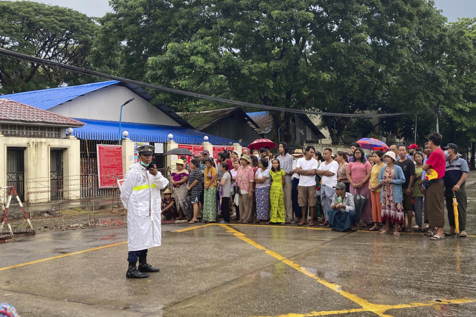 People wait for their family members and relatives outside Insein Prison Thursday, Nov. 17, 2022, in Yangon, Myanmar. The country's military-controlled government announced Thursday it was releasing and deporting an Australian academic, a Japanese filmmaker, an ex-British diplomat and an American as part of a broad prisoner amnesty to mark the country’s National Victory Day. (AP Photo)