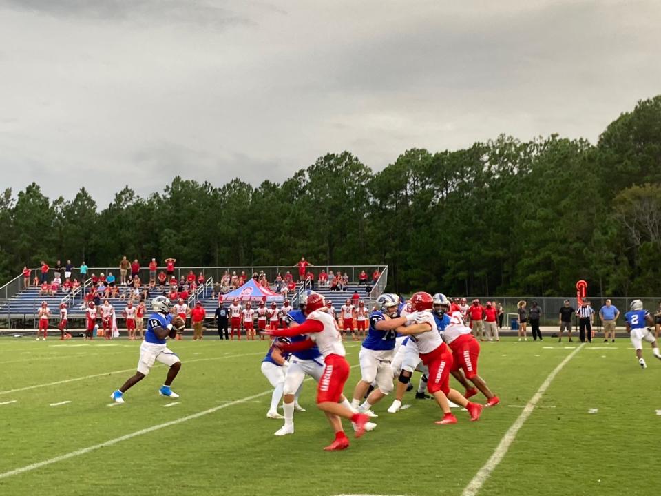 Bartram Trail quarterback Jaden Weatherly drops back to pass against Seabreeze.