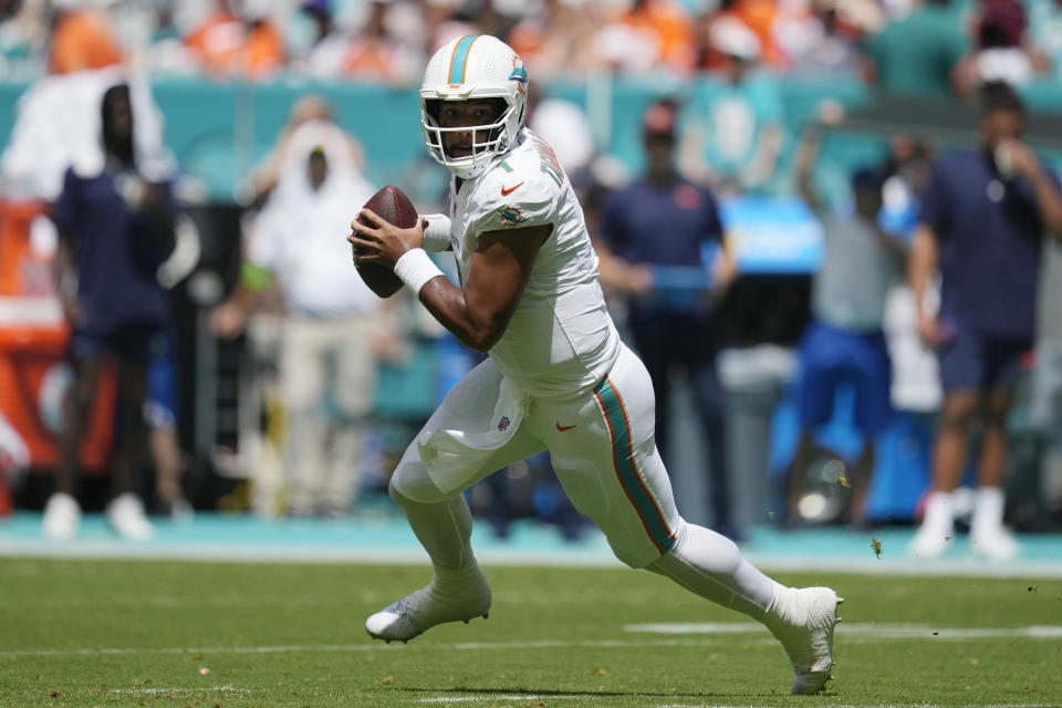 FILE - Miami Dolphins quarterback Tua Tagovailoa (1) runs with the ball during the first half of an NFL football game against the Denver Broncos, Sunday, Sept. 24, 2023, in Miami Gardens, Fla. Tagovailoa is a finalist for The Associated Press 2023 Comeback Player of the Year.(AP Photo/Rebecca Blackwell, File)