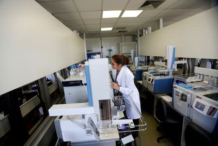 A woman works at the Brazilian Laboratory of Doping Control during its inauguration before the 2016 Rio Olympics in Rio de Janeiro, Brazil, May 9, 2016. REUTERS/Ricardo Moraes/File Photo