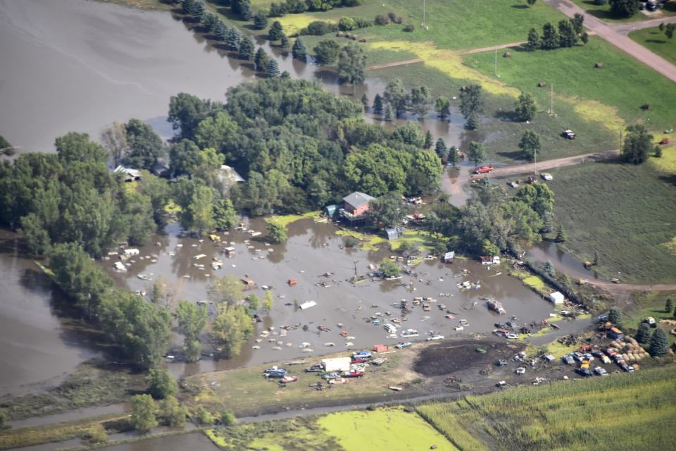 RETRANSMISSION TO ADD LOCATION OF SPENCER SD - This Saturday, Sept. 14, 2019 photo provided by the South Dakota Civil Air Patrol shows an aerial view of the flooding in Spencer, S.D. Flooding from torrential rain that's soaked much of southeastern South Dakota has closed schools for a second day, submerged city streets and caused some to evacuate their homes. (South Dakota Civil Air Patrol via AP)