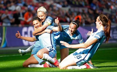 Manchester City's Carli Lloyd celebrates scoring their third goal with team mates - Credit: Action Images via Reuters / Matthew Childs