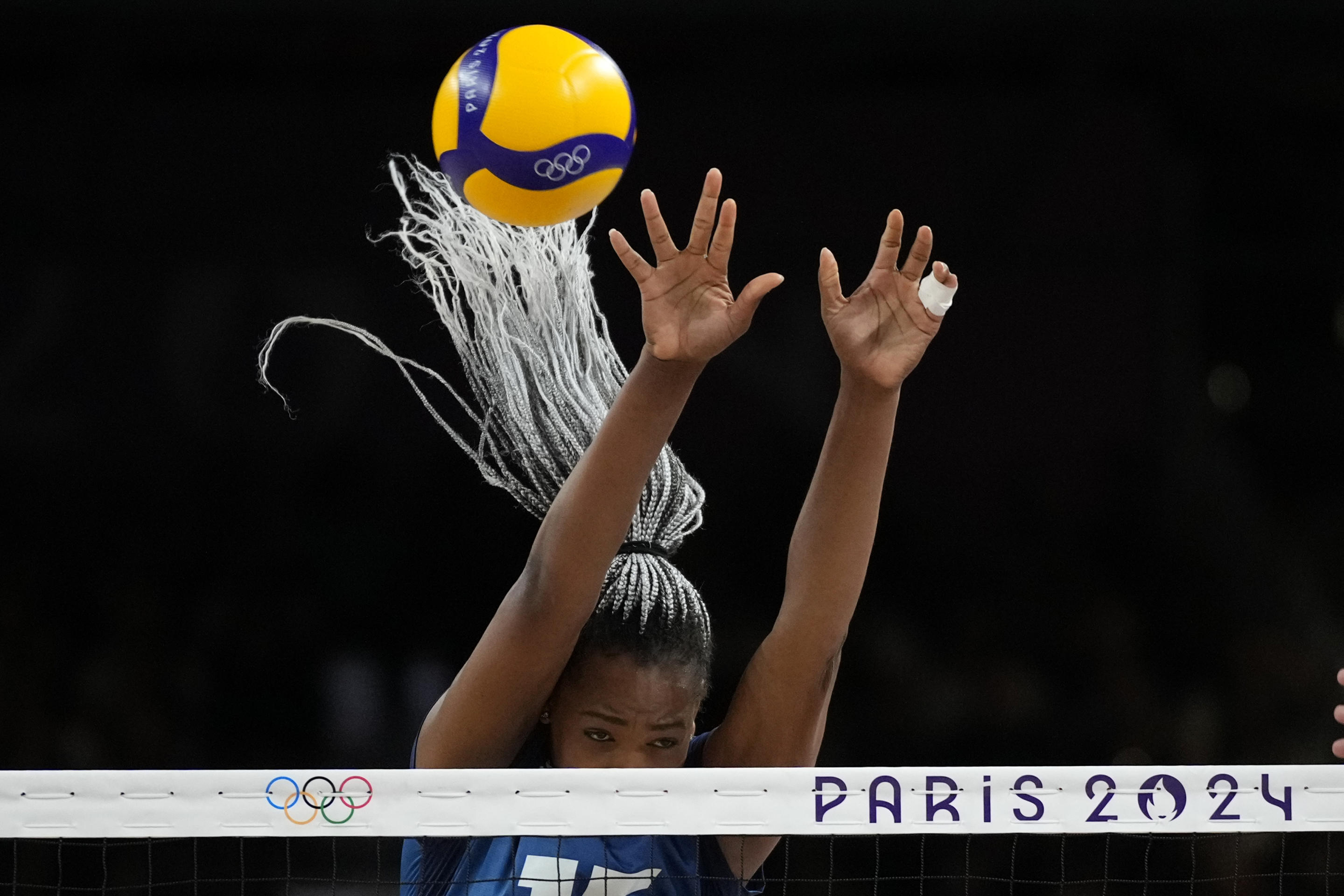 France's Amandha Sylves blocks a ball during the group A women's volleyball match between France and Serbia at the 2024 Summer Olympics on July 29, 2024, in Paris, France. (Alessandra Tarantino/AP)