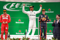 Formula One - F1 - Chinese Grand Prix - Shanghai, China - 09/04/17 - Winner Mercedes driver Lewis Hamilton of Britain celebrates on the podium with Ferrari driver Sebastian Vettel of Germany and Red Bull Racing driver Max Verstappen of the Netherlands after the Chinese Grand Prix at the Shanghai International Circuit. REUTERS/Aly Song