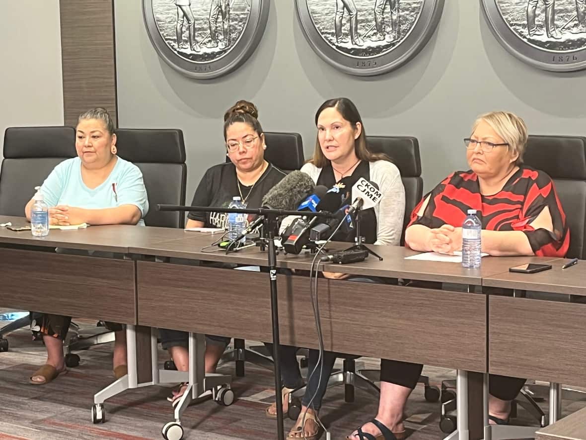 Kathy Walker, second from right, speaks during a Federation of Sovereign Indigenous Nations news conference in support of her sister, 48-year-old Dawn Walker, a Saskatoon mother whose disappearance led to extensive searches and her arrest. (Yasmine Ghania/CBC - image credit)