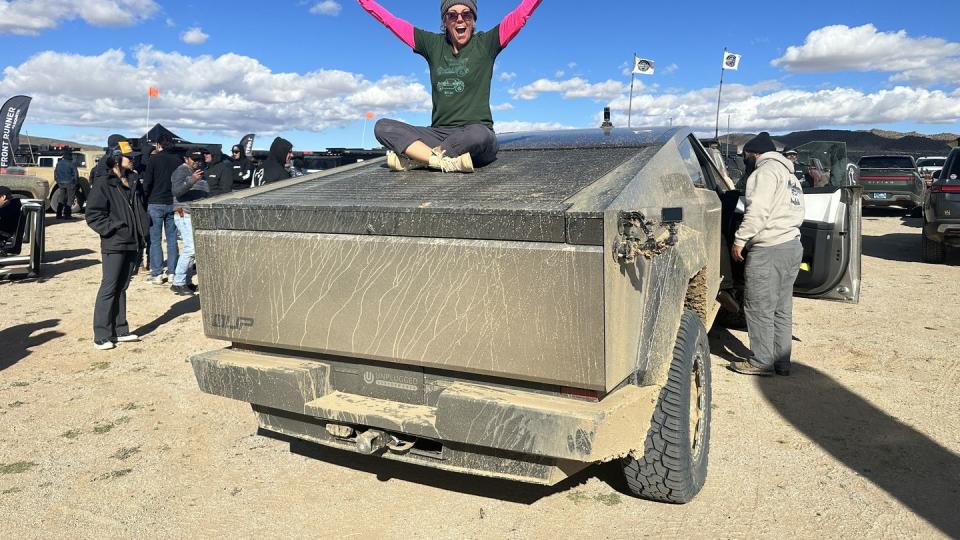 a man sitting on a tank