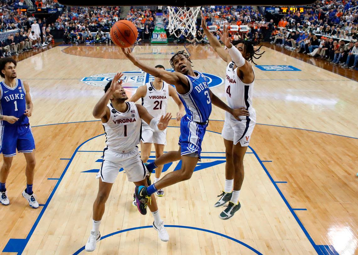 Duke’s Jeremy Roach (3) heads to the basket between Virginia’s Jayden Gardner (1) and Armaan Franklin (4) during Duke’s 59-49 victory over Virginia to win the ACC Men’s Basketball Tournament in Greensboro, N.C., Saturday, March 11, 2023.