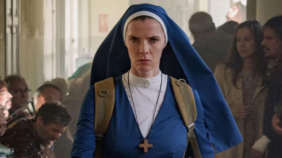 Betty Gilpin stars as Simone, or possibly Lizzie, in Peacock's strange new show science-fiction fantasy-comedy "Mrs. Davis."