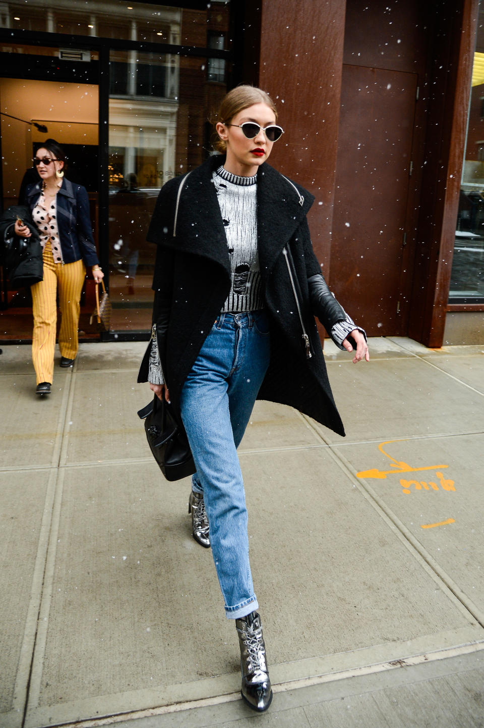 Gigi Hadid out in New York wearing lace-up pointy boots. [Photo: Getty]