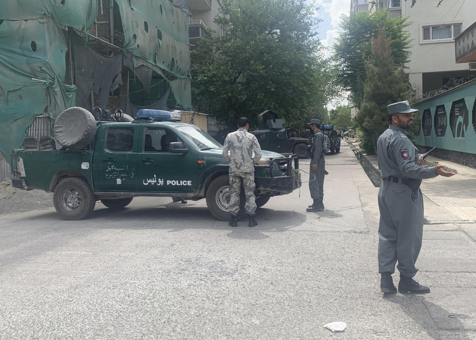 Afghan police arrive at the site of an explosion in a mosque, Friday, June 12, 2020, in Kabul, Afghanistan. A bomb exploded Friday inside a mosque in west Kabul causing deaths and injuries, an Afghan government official said. (AP Photo/Rahmat Gul)
