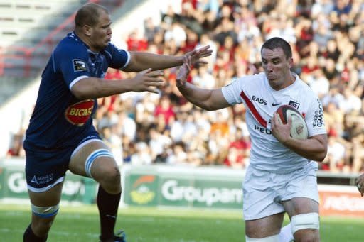 Toulouse's flancker Louis Picamoles (R) clashes with Agen's lock William Demotte during their French Top 14 rugby union match at the Ernest Wallon Stadium in Toulouse, southern France. Toulouse won 62-13