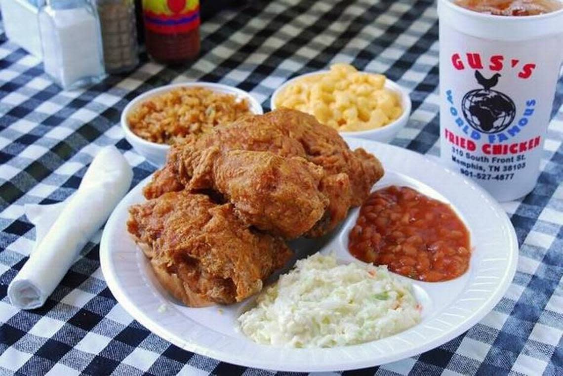 Gus’s serves spicy friend chicken along with baked beans, fried green tomatoes, mashed potatoes and gravy, fried okra and slaw.