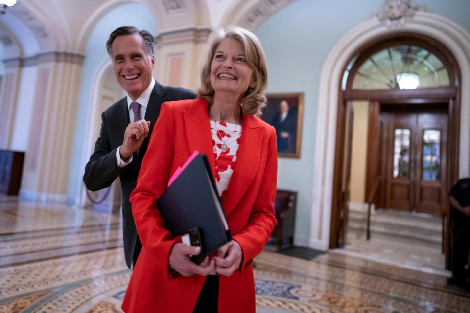 Lisa Murkowski with Mitt Romney (Copyright 2022 The Associated Press. All rights reserved)