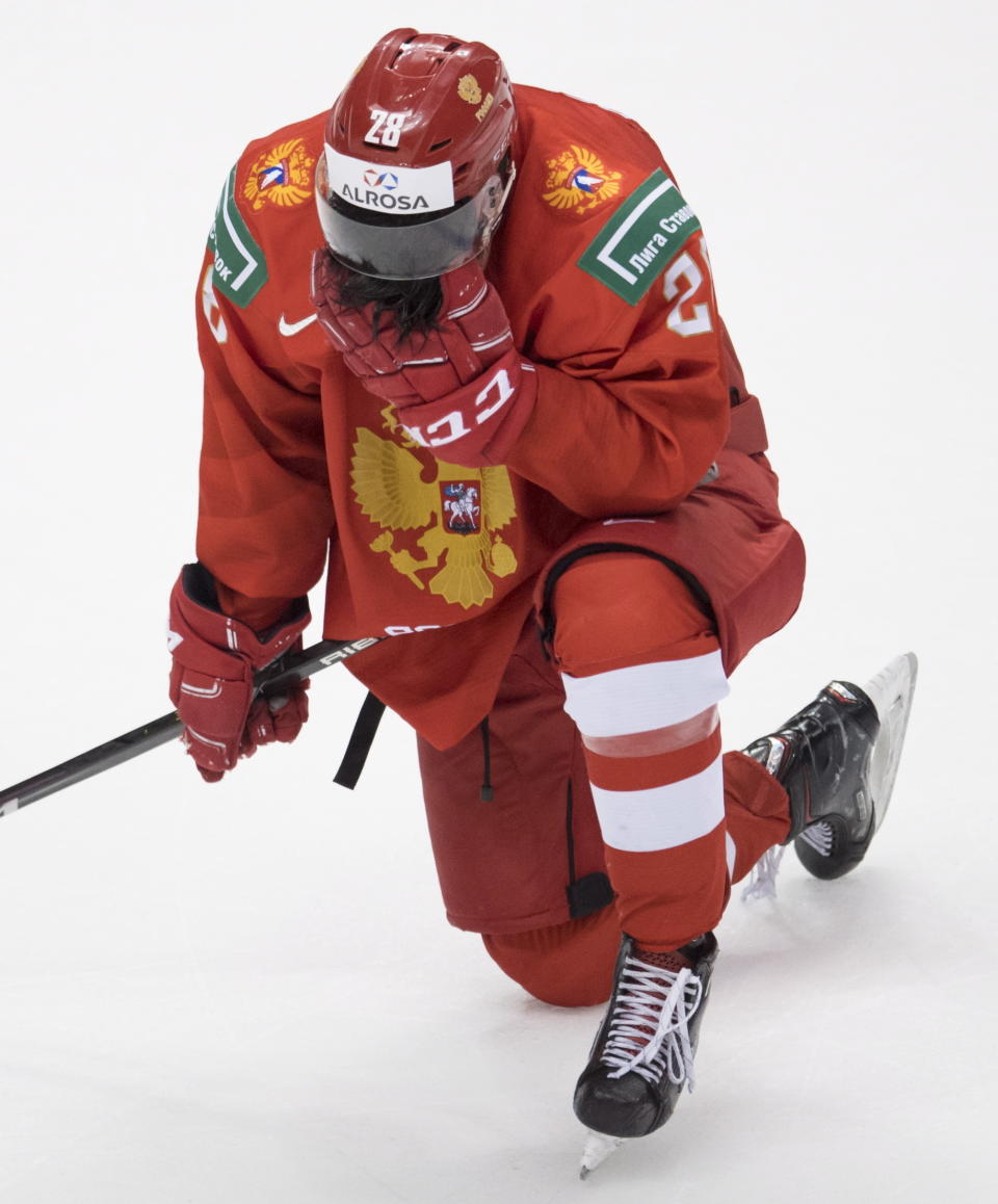 Russia's Grigori Denisenko reacts to the team's loss to the United States in a world junior hockey championships semifinal in Vancouver, British Columbia, Friday, Jan. 4, 2019. (Jonathan Hayward/The Canadian Press via AP)