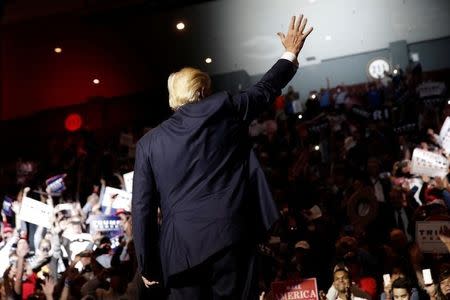 Republican U.S. presidential nominee Donald Trump walks on stage at a campaign rally in Cincinnati, Ohio, U.S., October 13, 2016. REUTERS/Mike Segar